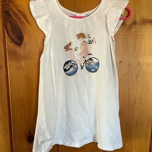 Little girl white ruffle bicycle t-shirt.